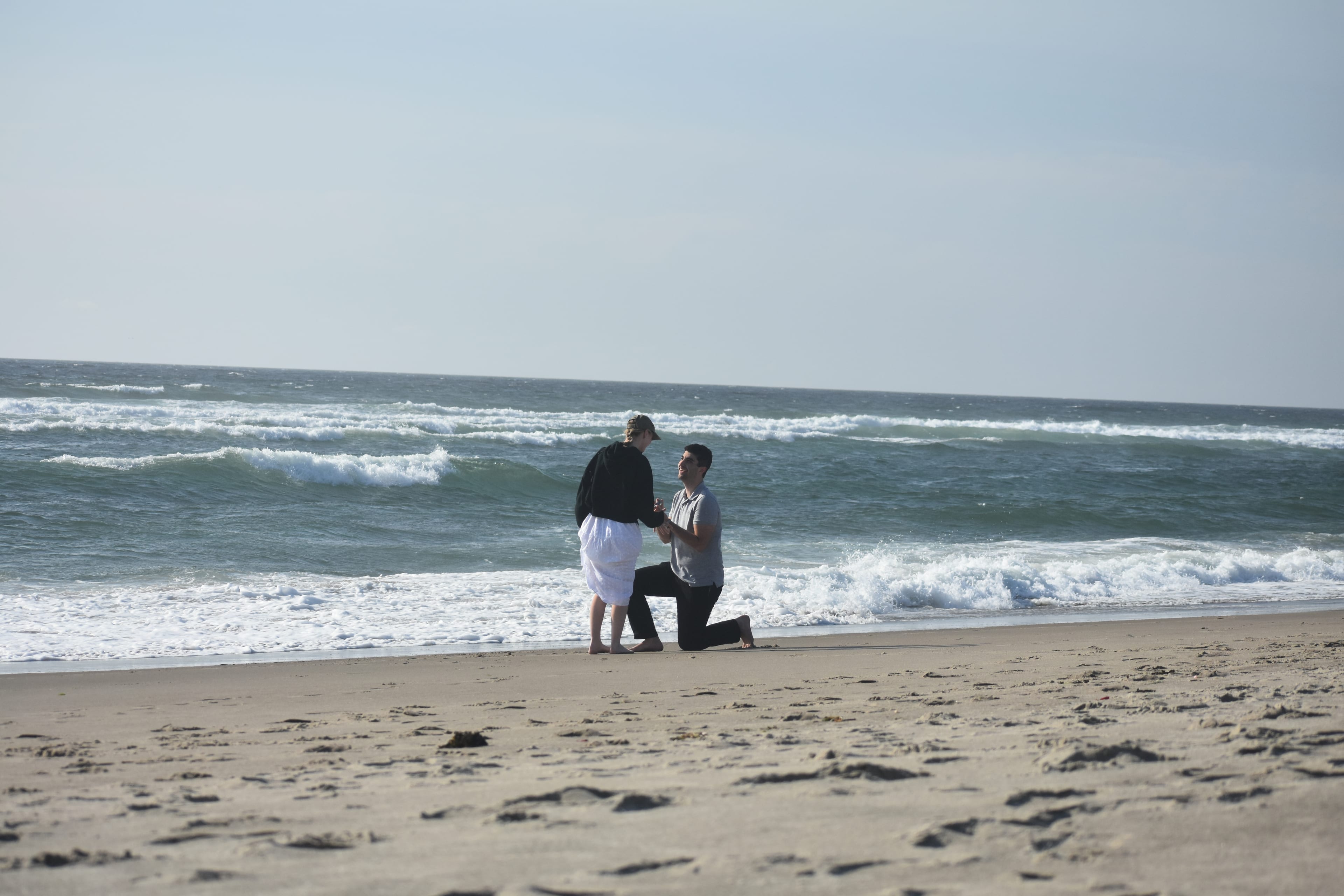 Andrew proposing on the beach